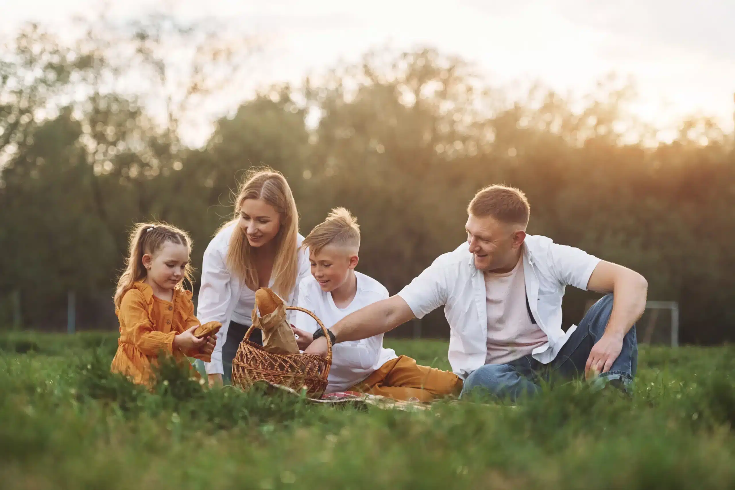 Family enjoying picnic outdoors, representing healthy lifestyle and family dental care in Horizon City TX