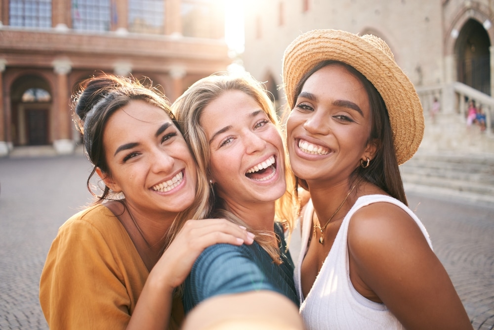 Group of women smiling together, representing confident smiles after Teeth Whitening in Horizon City