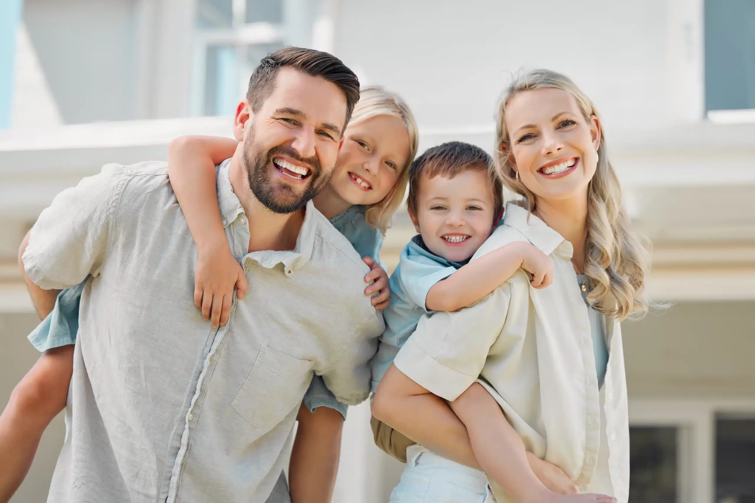Happy family smiling together, representing family dental care in Horizon City, TX