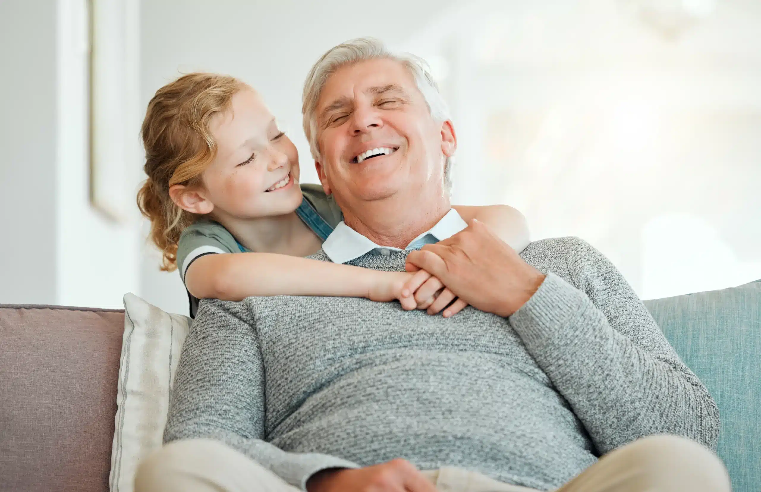 Grandfather and child smiling together, he was happy for the Dental Crowns in Horizon City TX