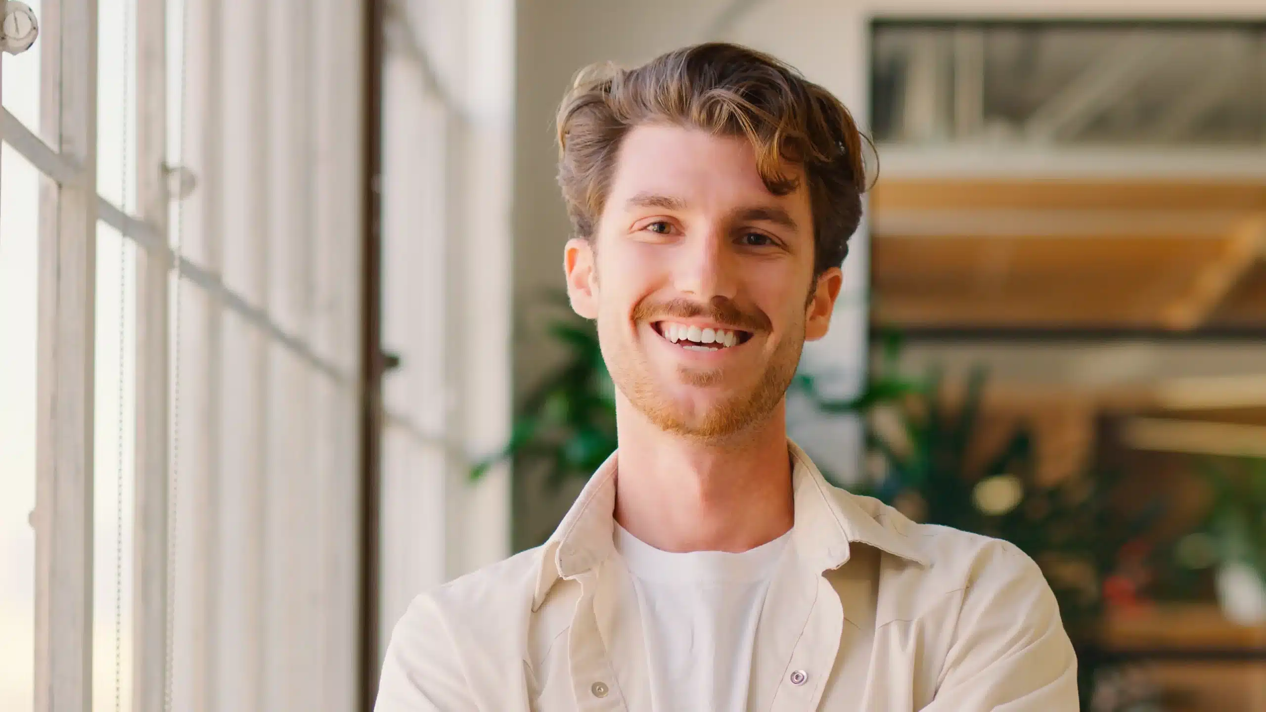 Smiling man with healthy teeth, representing successful dental Crown treatment